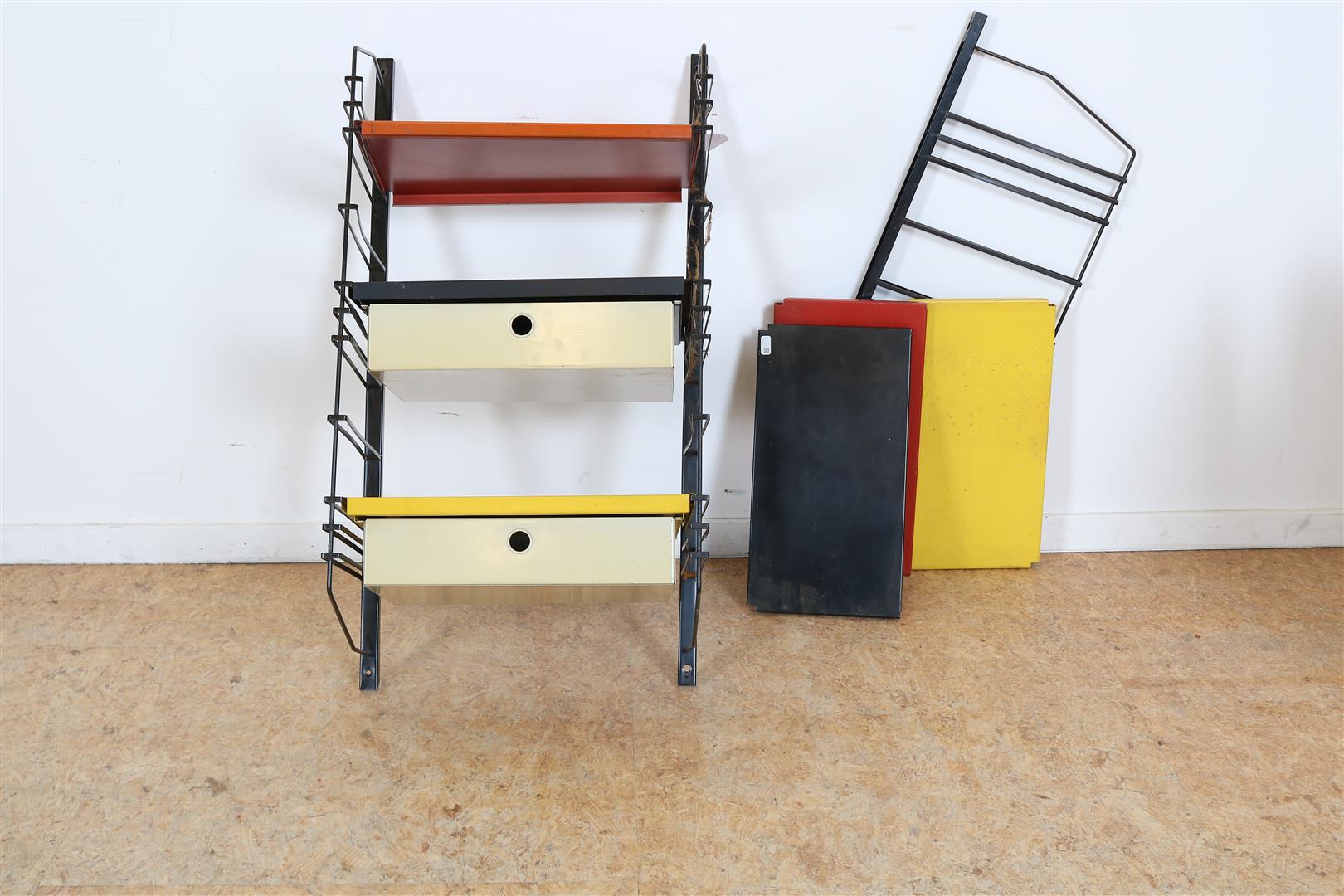 Wall rack with two black supports and 3 beams in red, black, yellow and 2 drawers, Tomado 1950s.