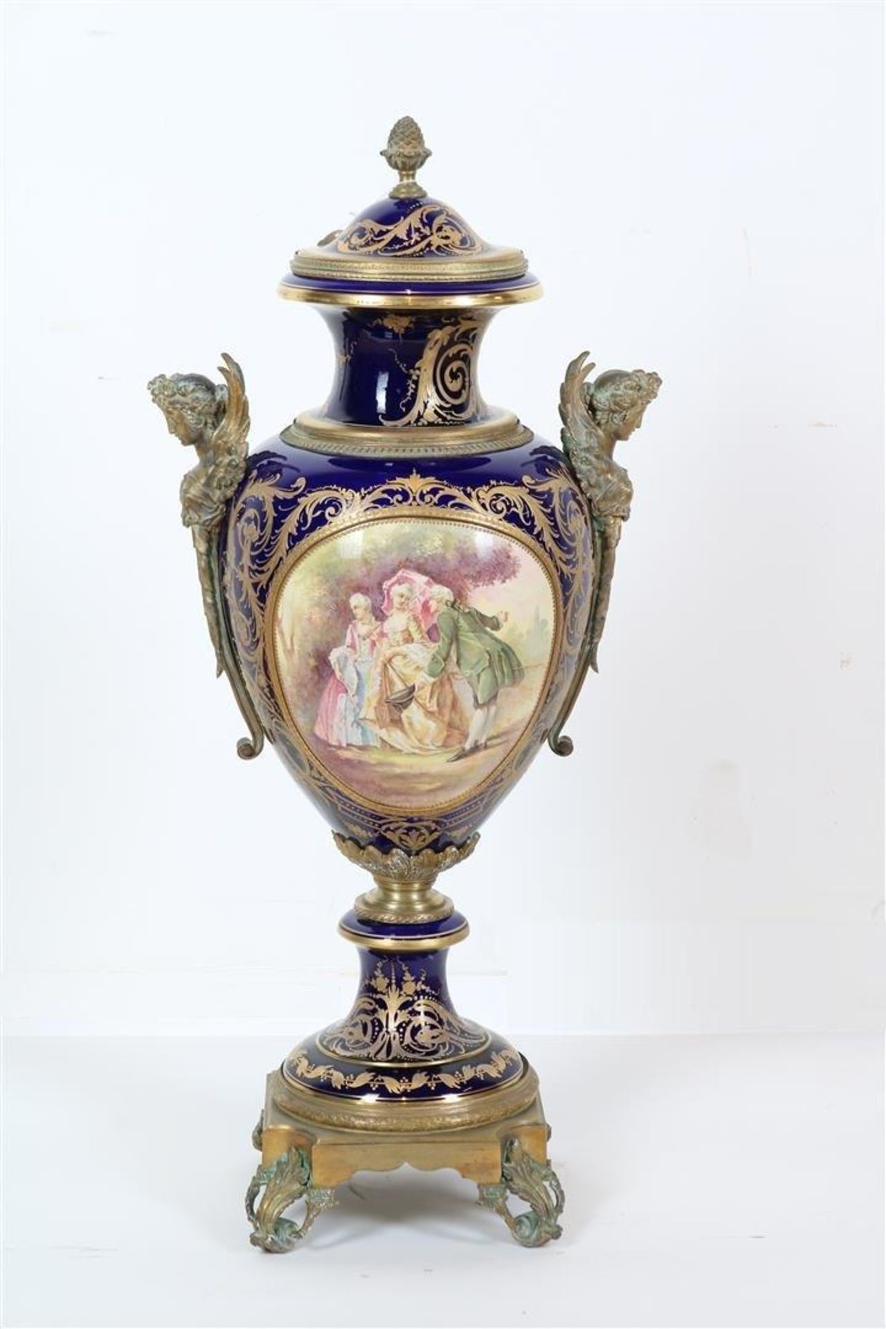 Porcelain Sevres urn vase with fixed lid, double painted decor of romantic scene of figures in