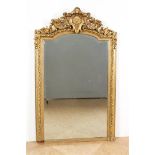 Cut mirror in gold lacquer Louis XV style frame crowned with rocaille motifs, 20th century, 165 x