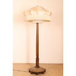 Art Deco standing lamp with cream-colored silk shade, trimmed with fringes.