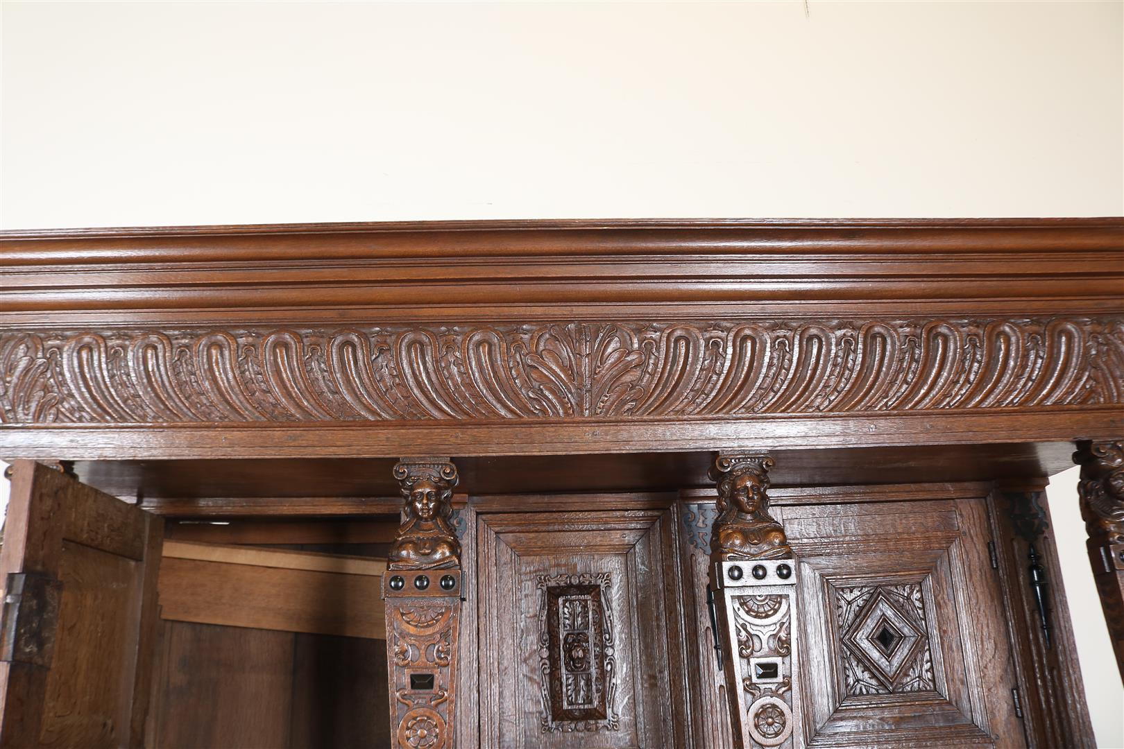 Oak Renaissance cabinet with richly carved crest, recessed elevation with 3 panel doors resting on 4 - Image 4 of 10