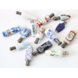 Lot of 14 porcelain perfume bottles with various paintings, 12 of which have silver caps.