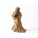 Partly gilded terracotta sculpture of kneeling Saint Francis of Paula (1416-1507) with beard and