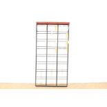 Black metal design wall coat rack with colored coat hooks and red hat shelf, Tjerk Reijen & Coen