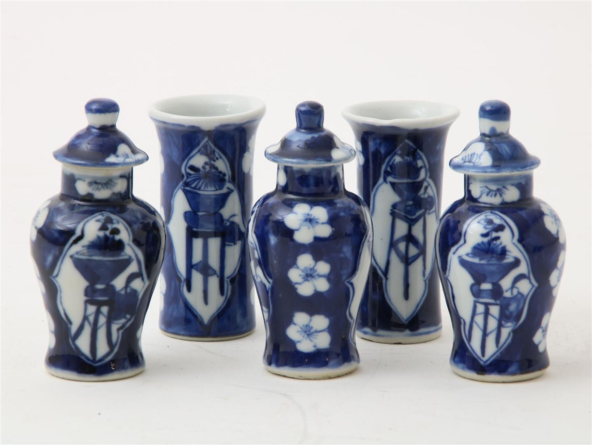 Porcelain miniature cupboard set, lidded vases and 2 tube vases decorated with cracked ice decor and