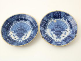 Set of earthenware Delft plates with peacock