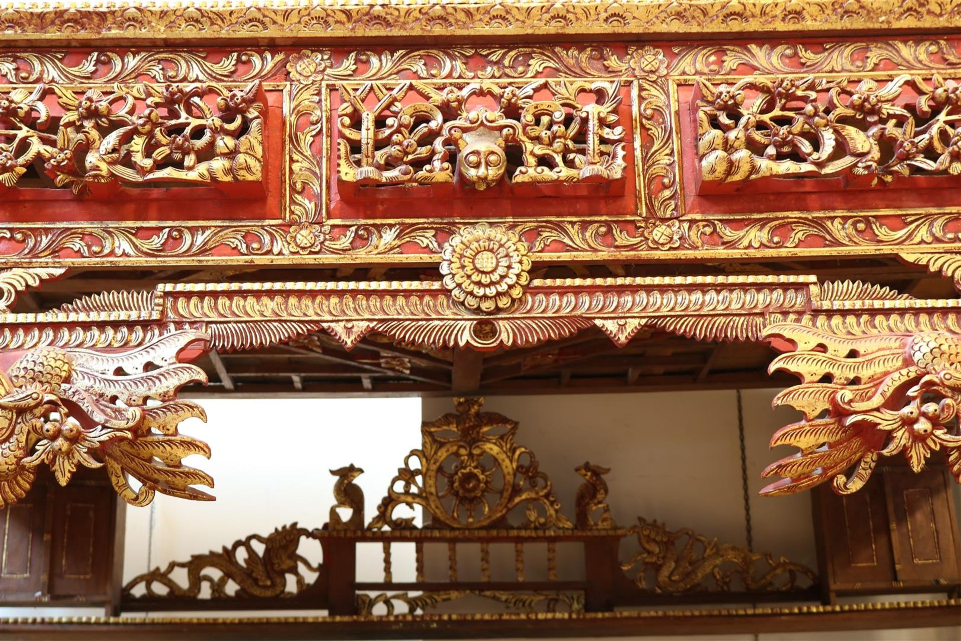 Red and gilded wooden traditional bedstead with carved birds, flowers and dragons, origin Madura, - Image 2 of 6
