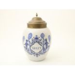 Earthenware tobacco jar with copper lid and text: Violet flanked by 2 smoking Indians, marked on the