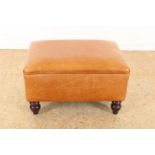Light brown leather tabouret on wooden ball legs, 34 x 60 x 43 cm.