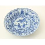 Kraak porcelain Ming dish with central decoration of 2 figures in landscape and edge decoration of