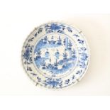 Earthenware dish with serrated edge, decorated with landscape, flowers and birds, Delft 18th