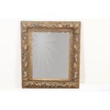 Mirror in richly carved wooden frame with acanthus leaves, 19th century, 78 x 68 cm. (mirror of