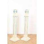 Set of white-painted decorative pillars with carved rosettes, height 100 cm.