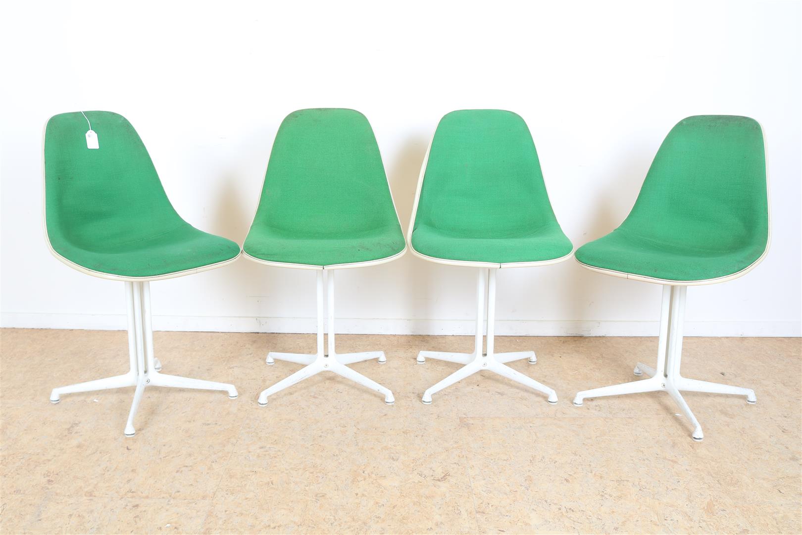 Series of 4 fiberglass design chairs with green upholstery on metal legs, designed by Charels