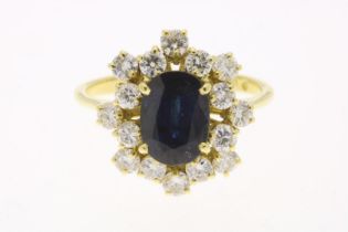Yellow gold entourage ring with sapphire and diamond