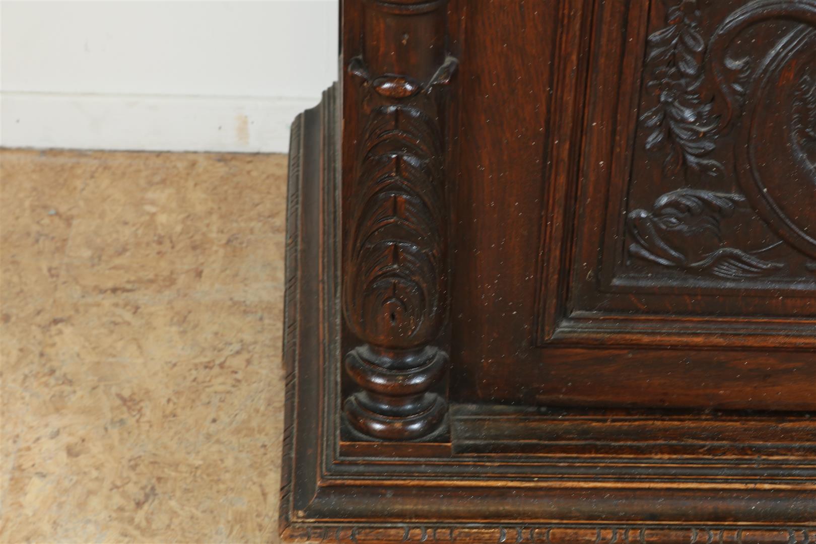 Oak two-door cupboard with 4 carved panels of garlands, putto, shell motifs and crown, flanked by - Image 9 of 9