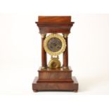 Empire column mantel clock with bronze dial in mahogany case, 19th century, height 41 cm.