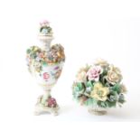 Lot of a porcelain decorative vase with decor of a romantic scene and relief of flowers, marked on