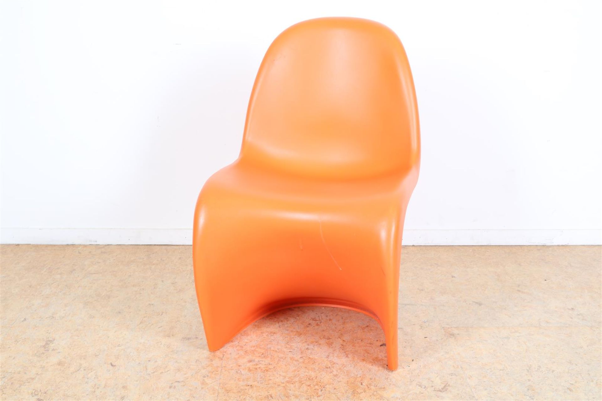 Orange plastic design chair, model: Panton Chair, designer: Verner Panton, for: Vitra, marked with