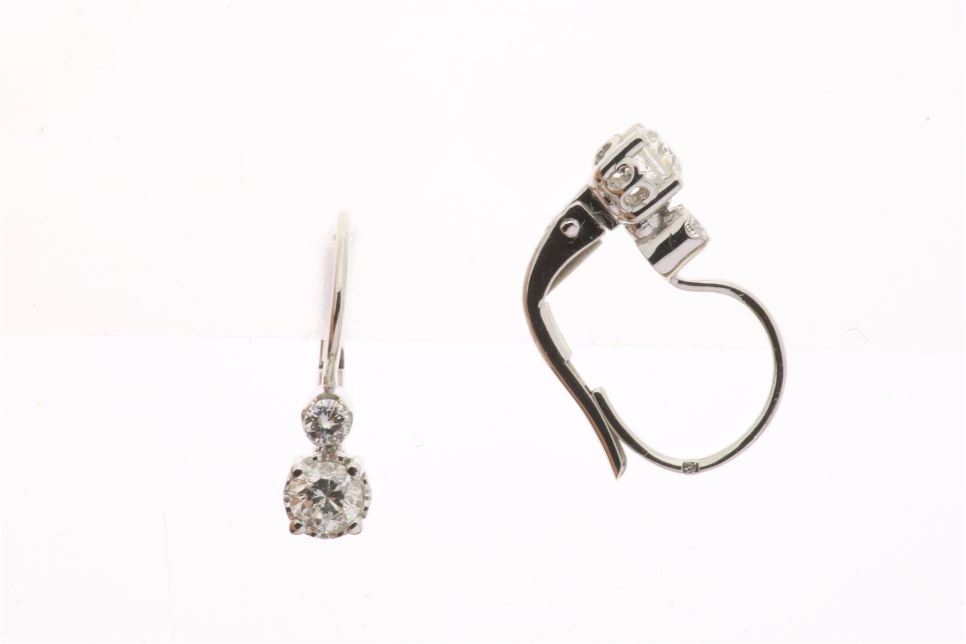 White gold earrings set with a central diamond, brilliant cut, approximately 0.66 ct., F/G, P1,