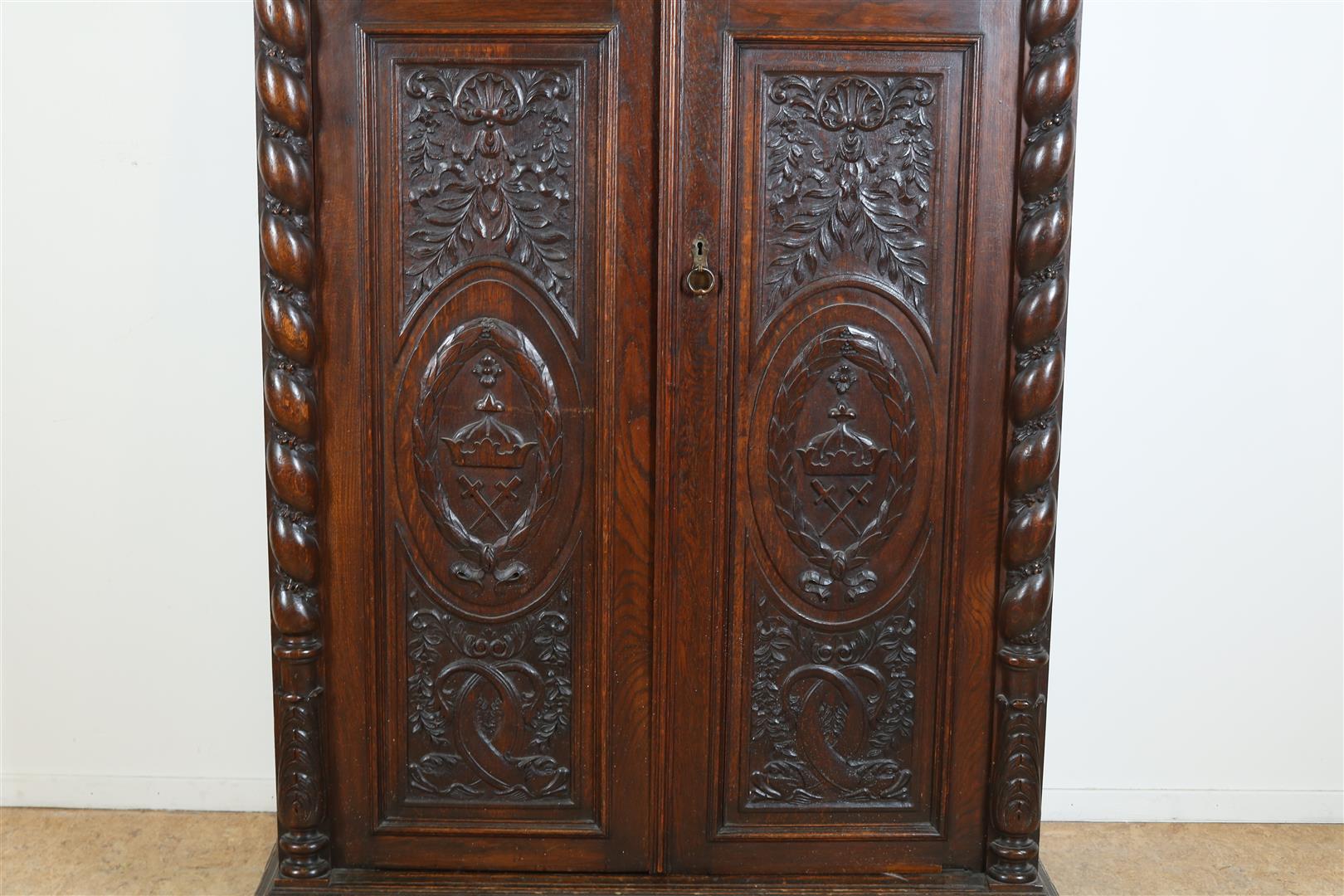 Oak two-door cupboard with 4 carved panels of garlands, putto, shell motifs and crown, flanked by - Image 5 of 9