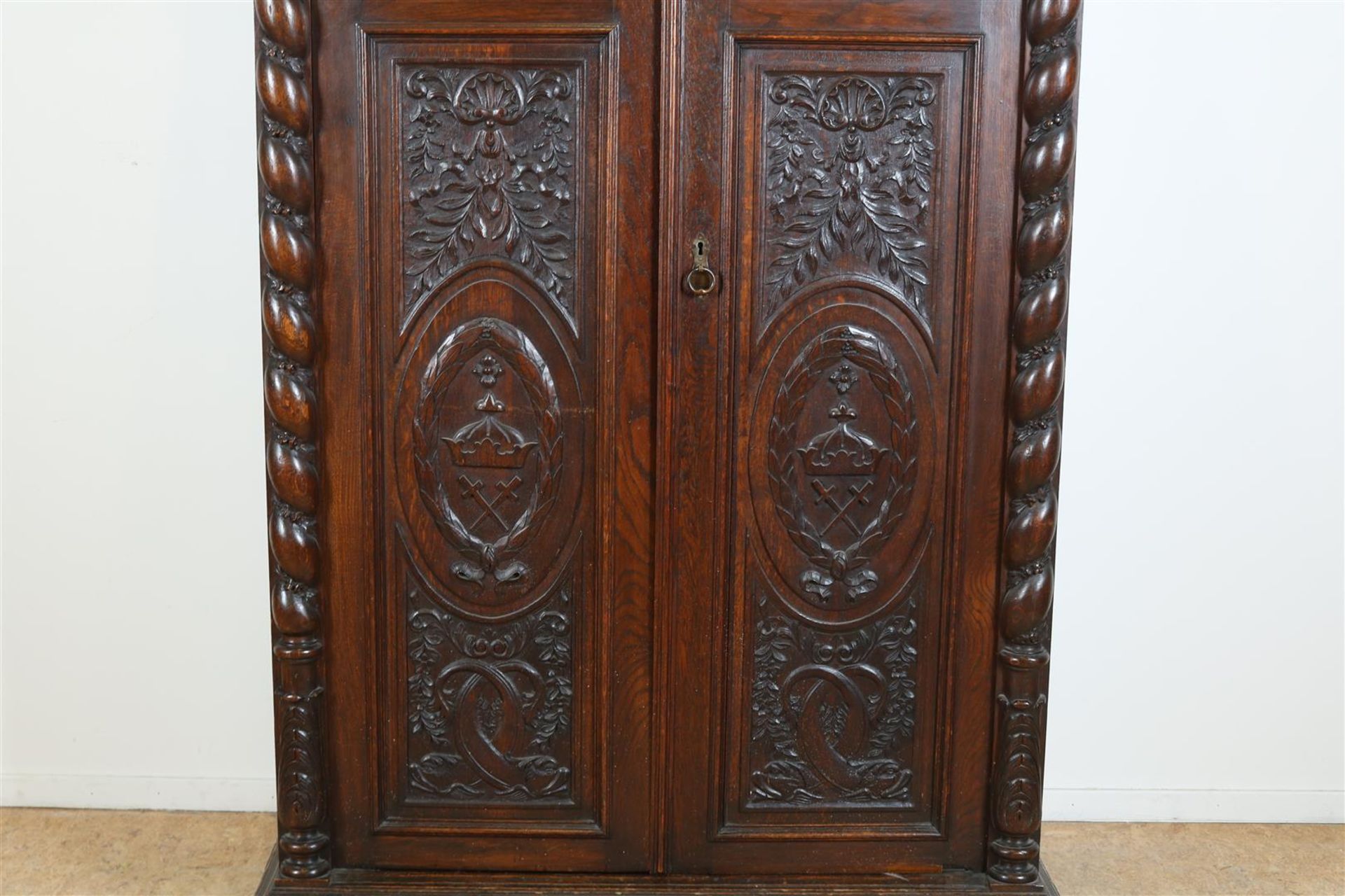 Oak two-door cupboard with 4 carved panels of garlands, putto, shell motifs and crown, flanked by - Image 5 of 9