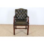 Stained wooden office chair with green padded leather upholstery.