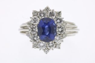 White gold entourage ring set with blue sapphire and brilliant cut diamonds