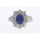 White gold entourage ring set with blue sapphire and brilliant cut diamonds, approx. 1.20 ct. (