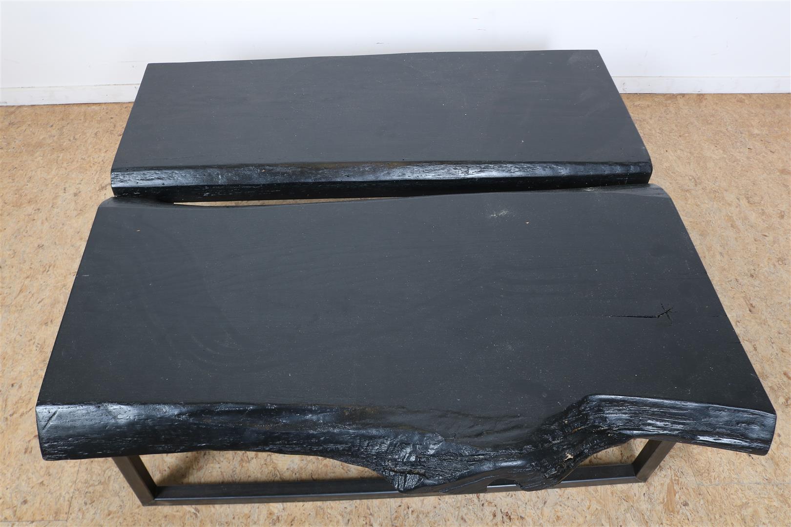 Black stained coffee table made of 2 tree trunks on an iron base, 34 x 110 x 110 cm. - Image 2 of 3