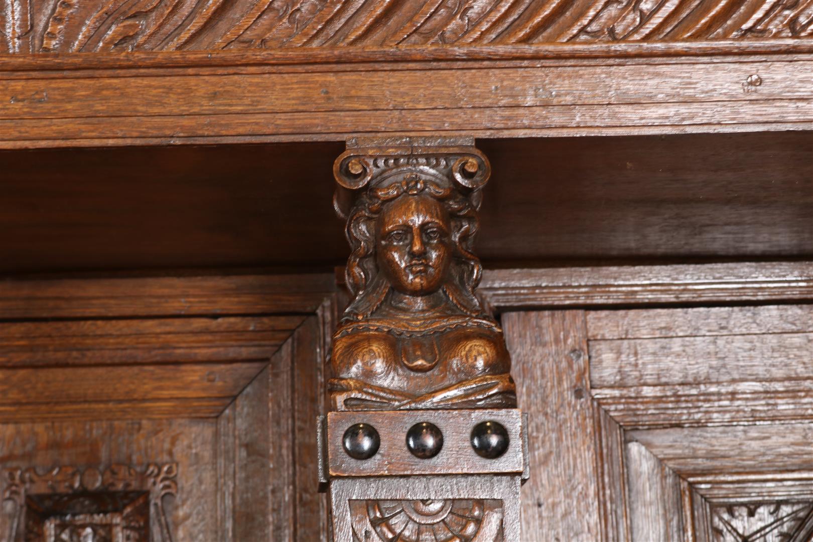Oak Renaissance cabinet with richly carved crest, recessed elevation with 3 panel doors resting on 4 - Image 7 of 10