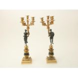 Set of bronze Empire style 5 light candlesticks carried by man and woman, France 20th century,