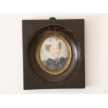 Miniature portrait with image of a lady, signed right Enzenberg 1828, watercolour, 13 x 10 cm.