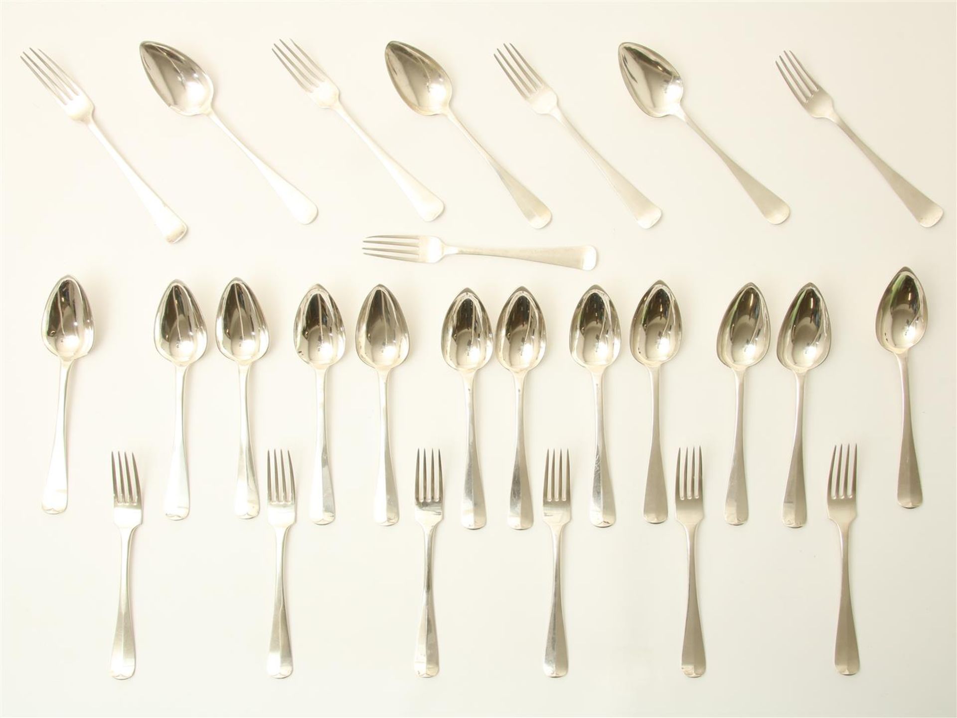 Lot of silver cutlery with 12 large spoons and 6 large forks, Haags Lofje, maker's mark: "VDB":