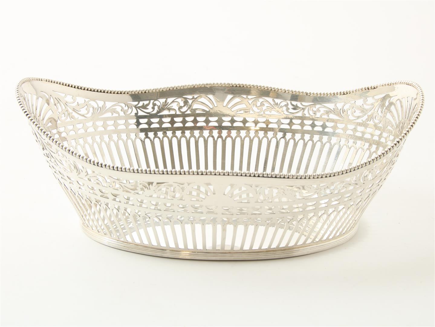 Silver openwork bread basket trimmed with pearl edge. maker's mark "B": C.L.J. Begeer, Utrecht (