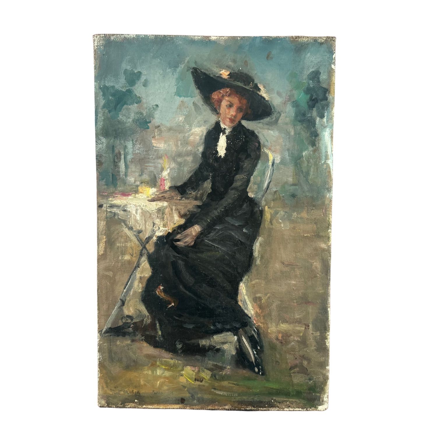 Woman in an elegant dress sitting at a small table