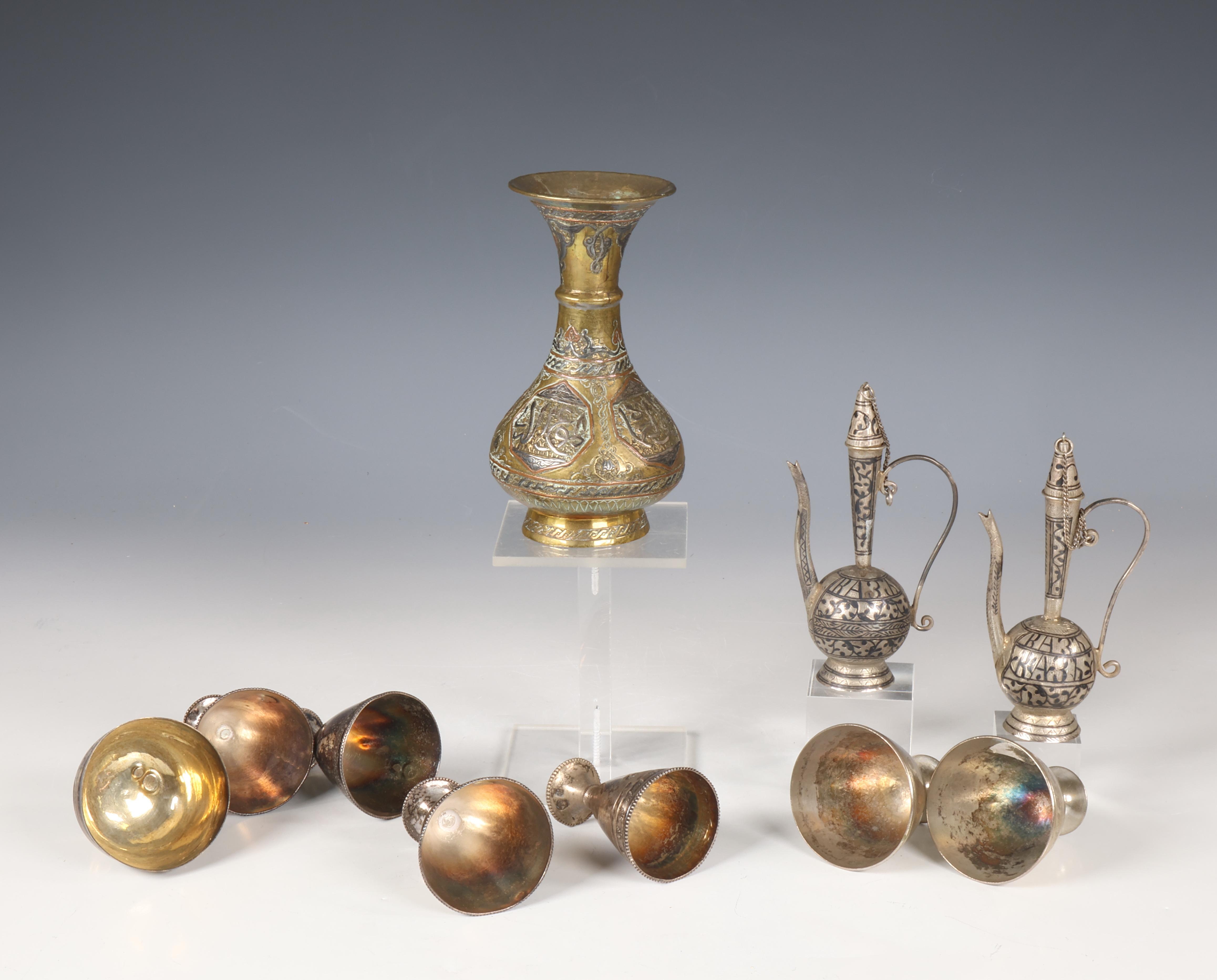 A collection of seven Ottoman silver alloy cups, stamped with Tughra of the Sultan; - Image 2 of 2
