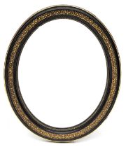 Ovale spiegel in zwart en vergulde cuivre-pouli lijst, Louis Philippe,