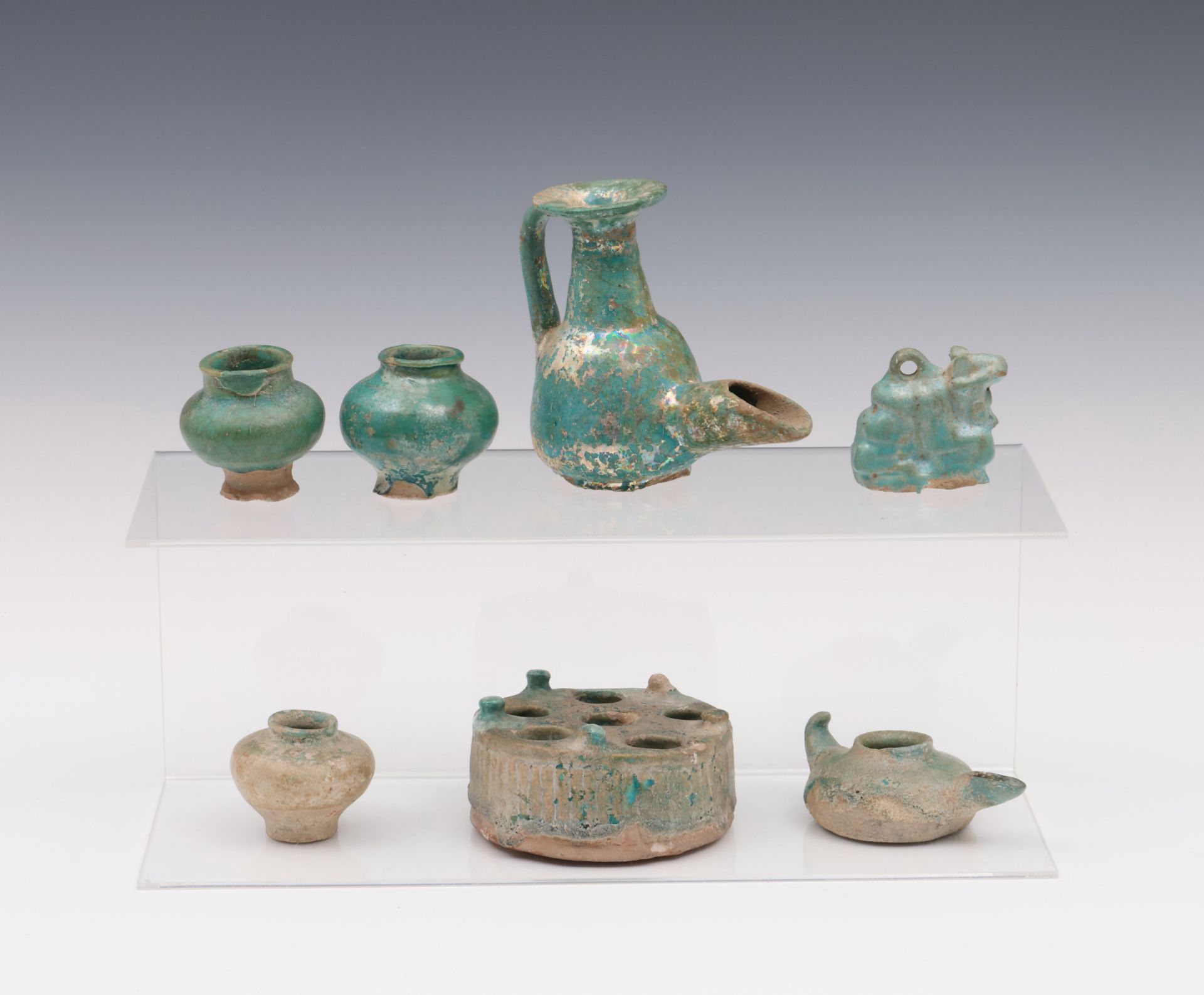A collection of seven turkois glazed objects, Middle East, Persia 13th century and later;