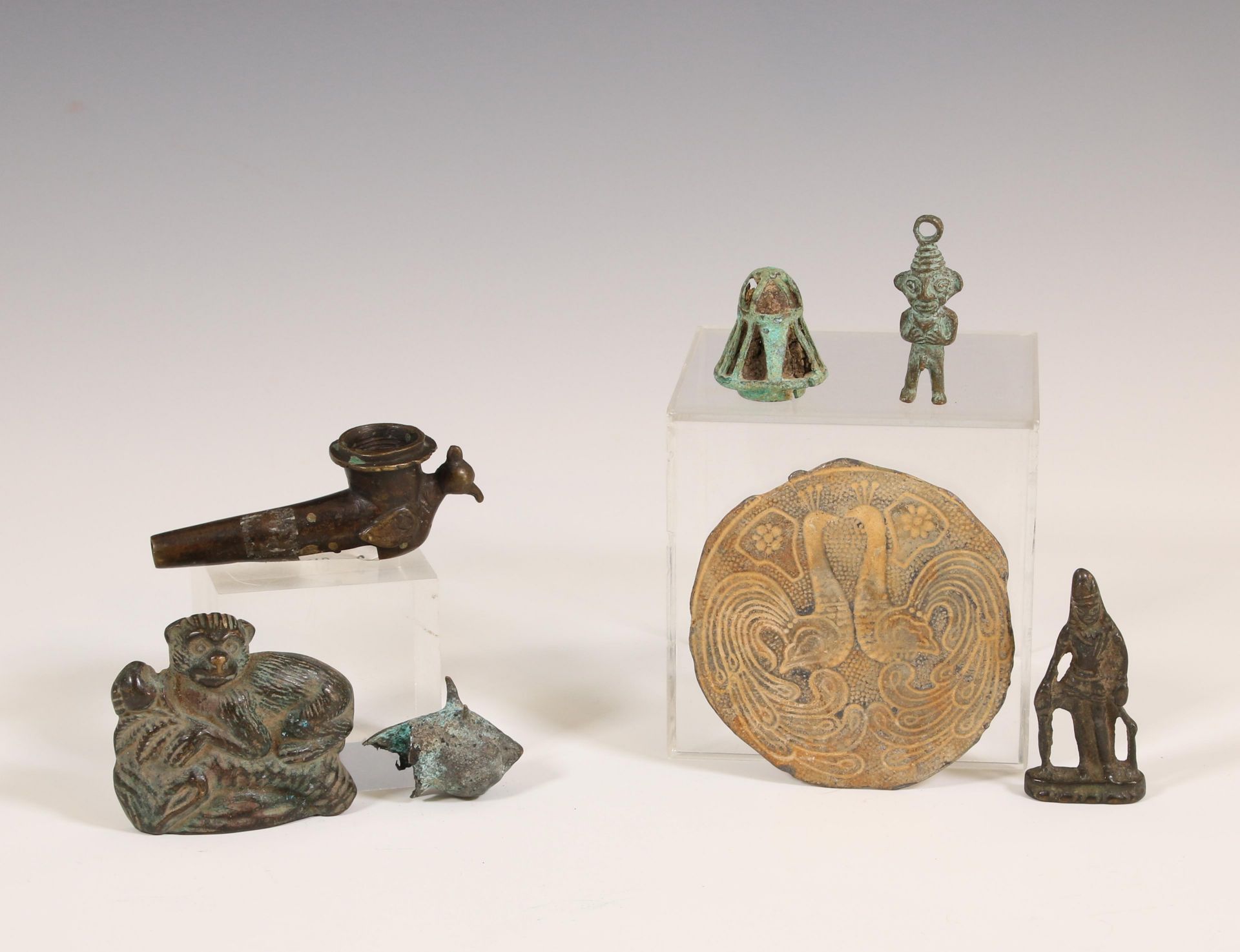 A collection of various bronze and metal objects;