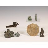 A collection of various bronze and metal objects;