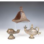 Iran, a metal horse shoe stirrup, a bronze oillamp and a bronze water sprinkler highlighted with sil