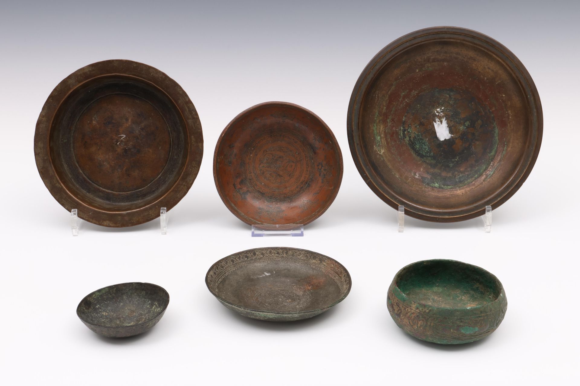 Six Persian and Ottoman bronze bowls, 11th - 17th century;