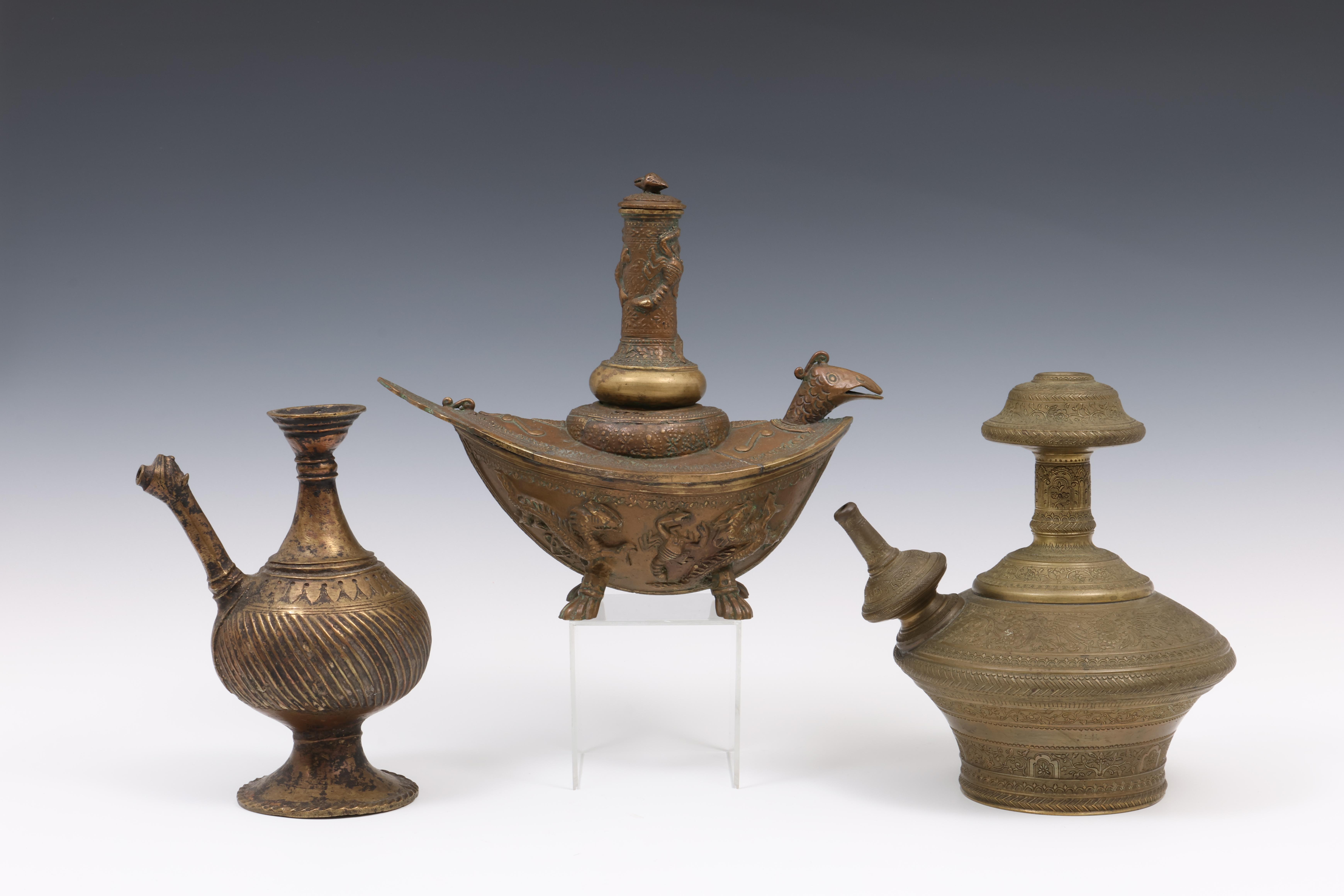 Near Eastern, a bronze antique ewer, India, a brass gendhi and Sumatra, Padang, bronze gendhi, 20th 