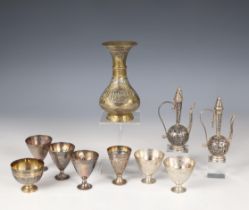 A collection of seven Ottoman silver alloy cups, stamped with Tughra of the Sultan;