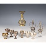 A collection of seven Ottoman silver alloy cups, stamped with Tughra of the Sultan;