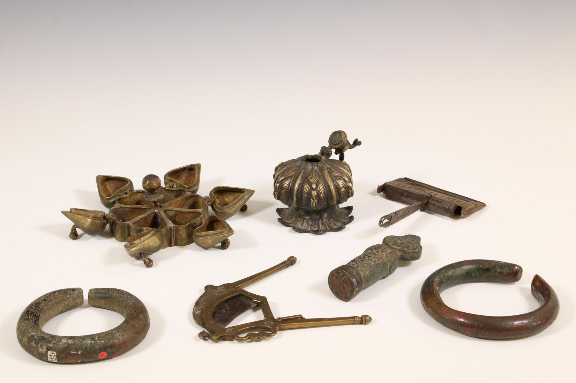 India, two bronze kohl containers, two bracelets, a brass betel cutter. - Image 2 of 2