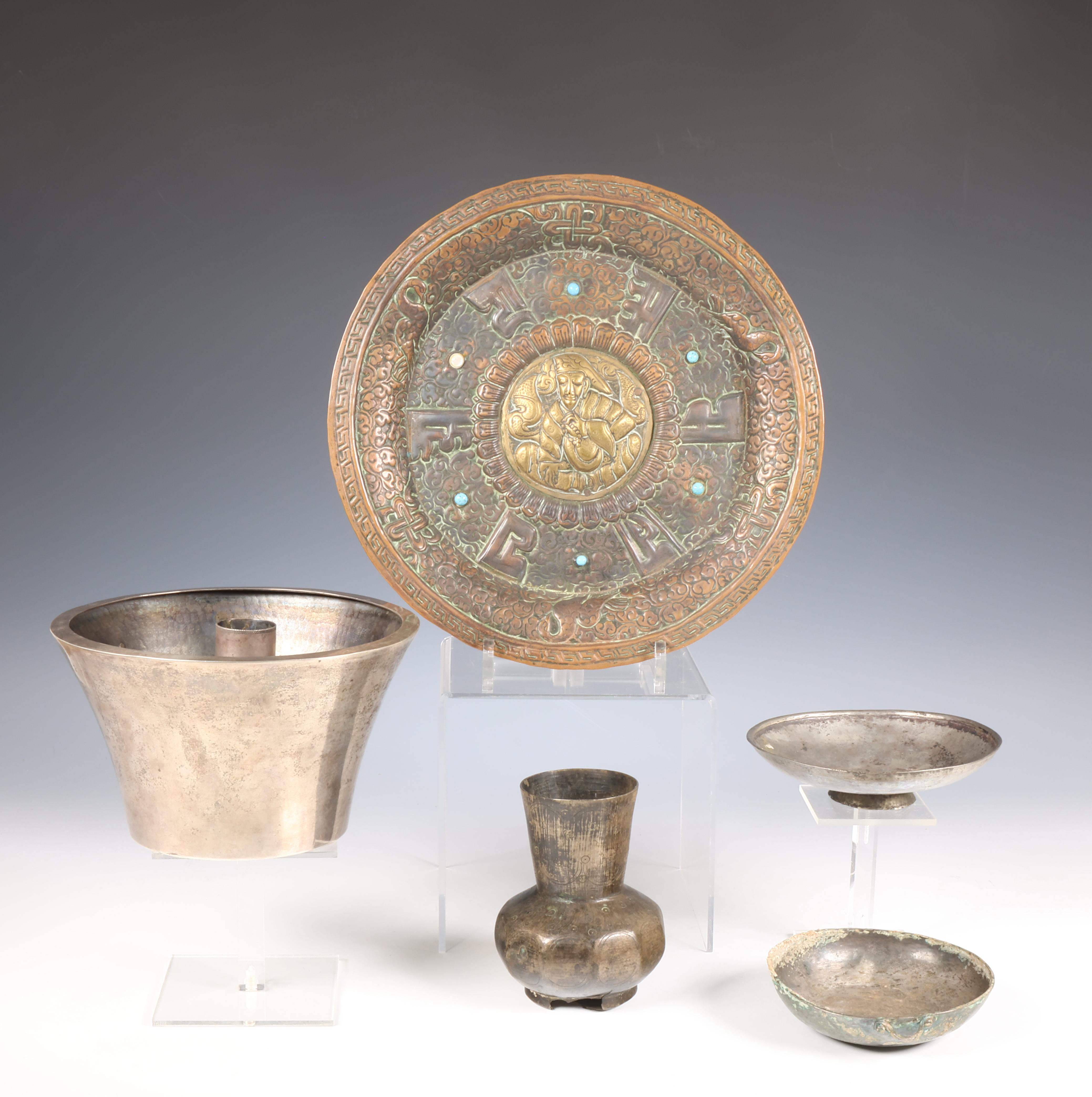 Near Eastern, a collection of four metal-silver alloy objects and a Tibetan metal plate