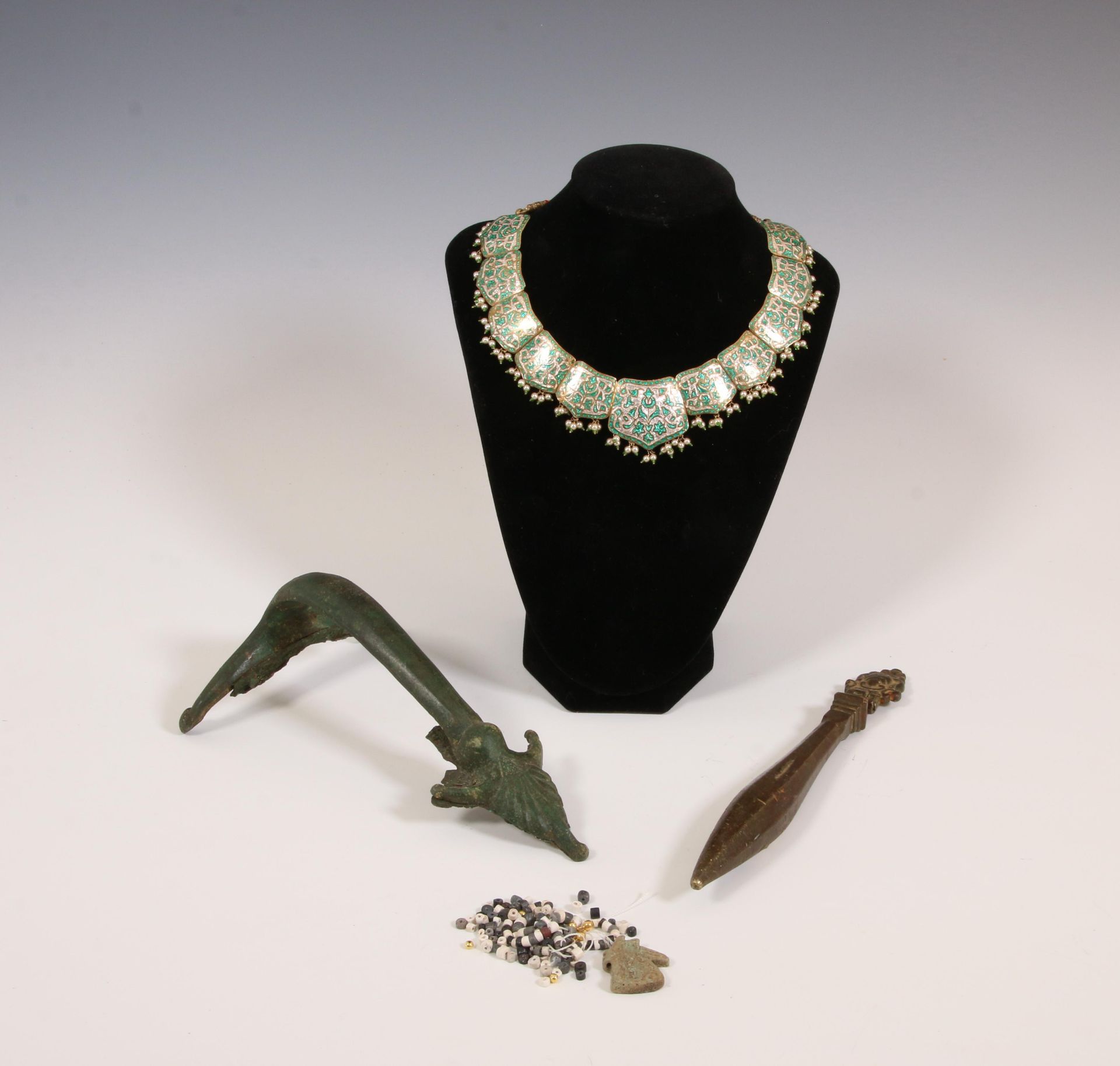 A antique bronze handle, a door nocker and a India necklace with enamel and a Egypt style beaded nec