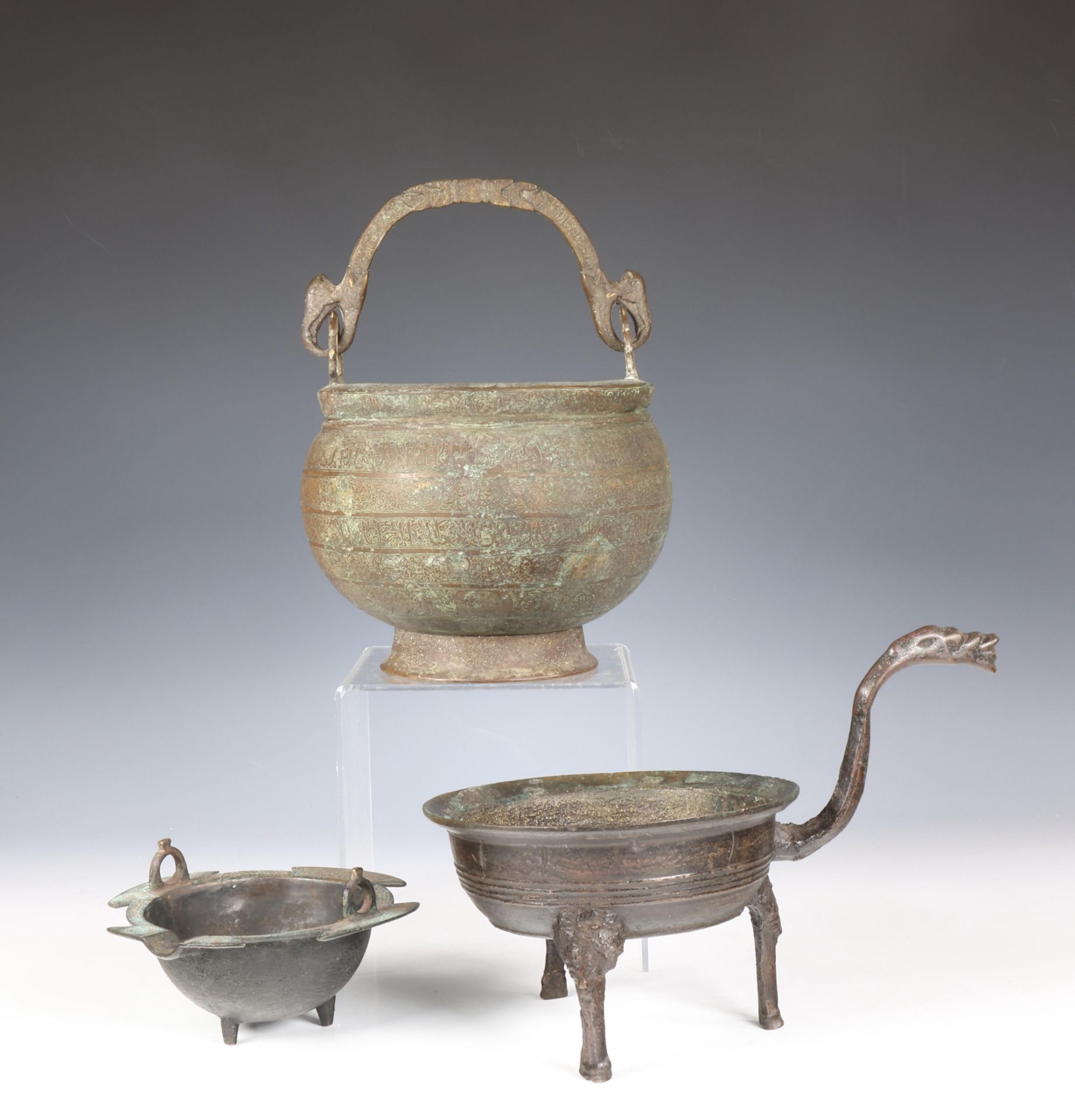 A Persian bronze tripot cauldron, Khorasan, 13th century or later.